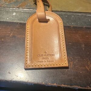 Louis Vuitton Tan used luggage tag